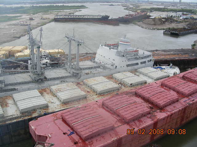 Barges pushed close together at awkward angles